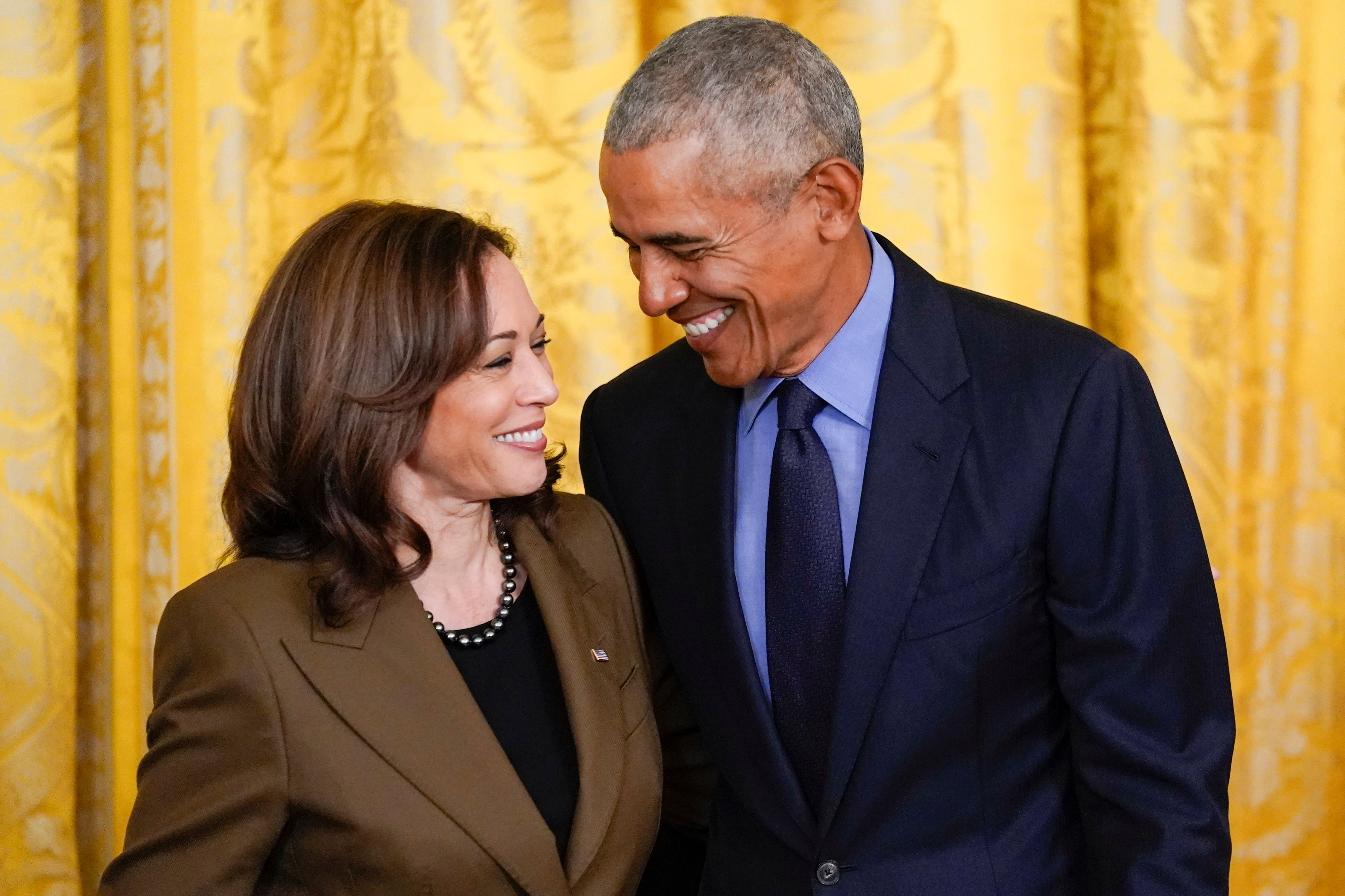 FILE - Former President Barack Obama talks with Vice President Kamala Harris during an event about the Affordable Care Act, in the East Room of the White House in Washington, April 5, 2022. Former President Barack Obama and former first lady Michelle Obama have endorsed Kamala Harris in her White House bid, giving the vice president the expected but still crucial backing of the nation’s two most popular Democrats. (AP Photo/Carolyn Kaster, File)