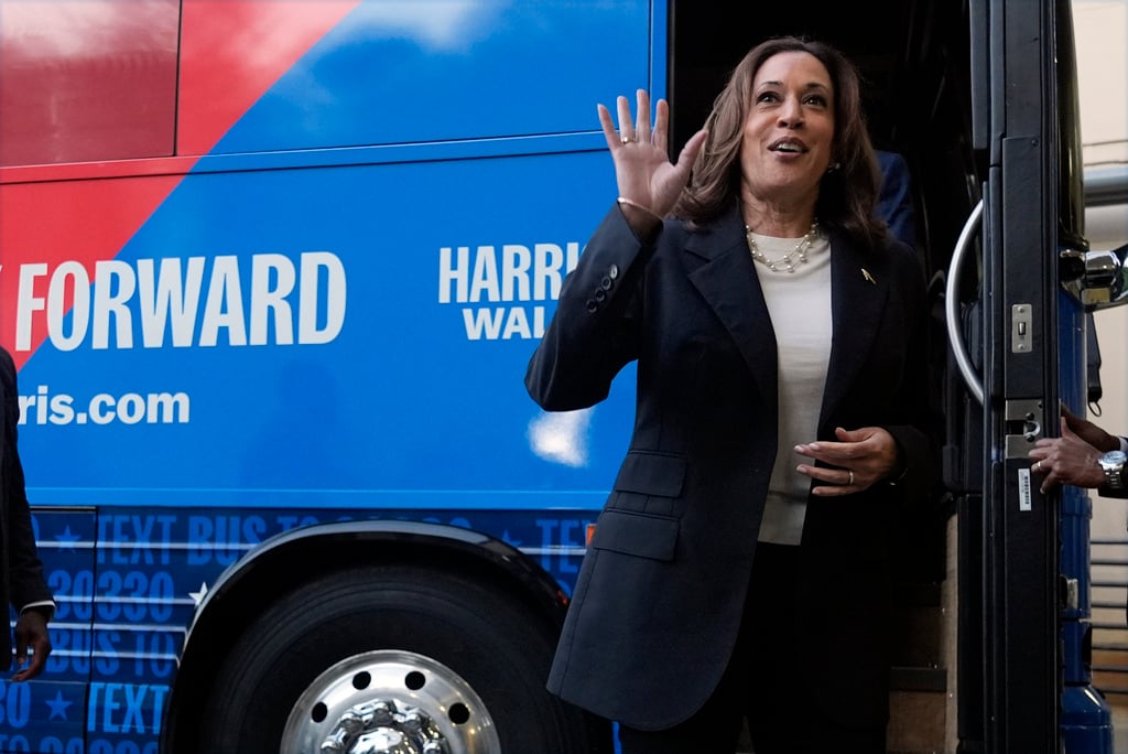 Democratic presidential nominee Vice President Kamala Harris waves as she exits her campaign bus in Savannah, Ga., Wednesday, Aug. 28, 2024. (AP Photo/Jacquelyn Martin)