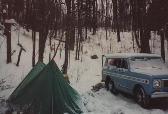 green tent in snow with HI Scout 