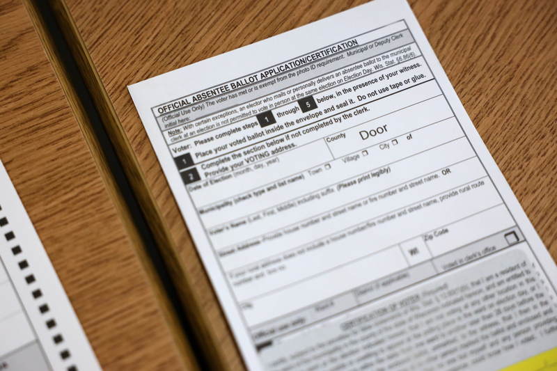 An absentee ballot envelope for the Nov. 8, 2022, election is seen at the village of Ephraim administration building in Door County, Wis., on Oct. 25, 2022. (Coburn Dukehart / Wisconsin Watch)