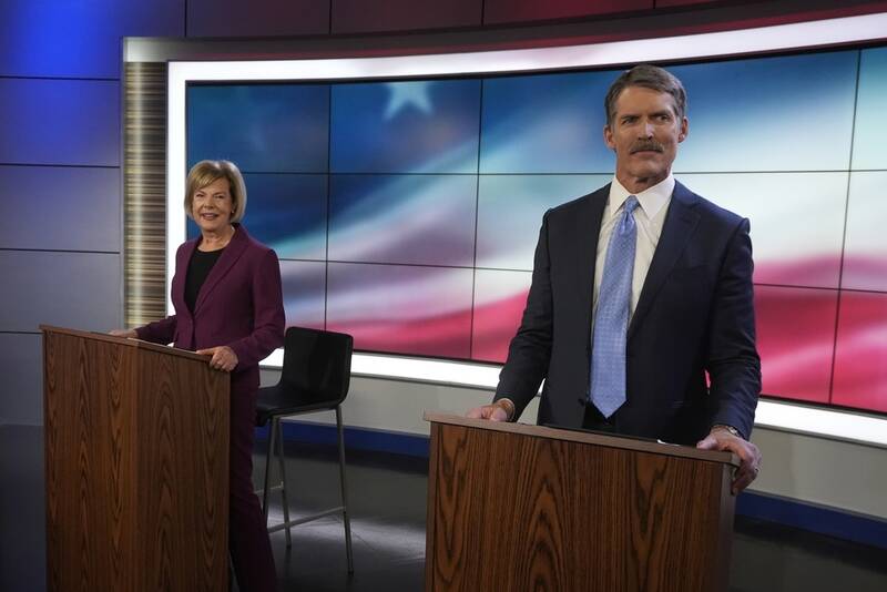 Wisconsin Senate candidates Republican Eric Hovde and Democratic U.S. Sen. Tammy Baldwin are seen before a televised debate Friday, Oct. 18, 2024, in Madison, Wis. (AP Photo/Morry Gash)