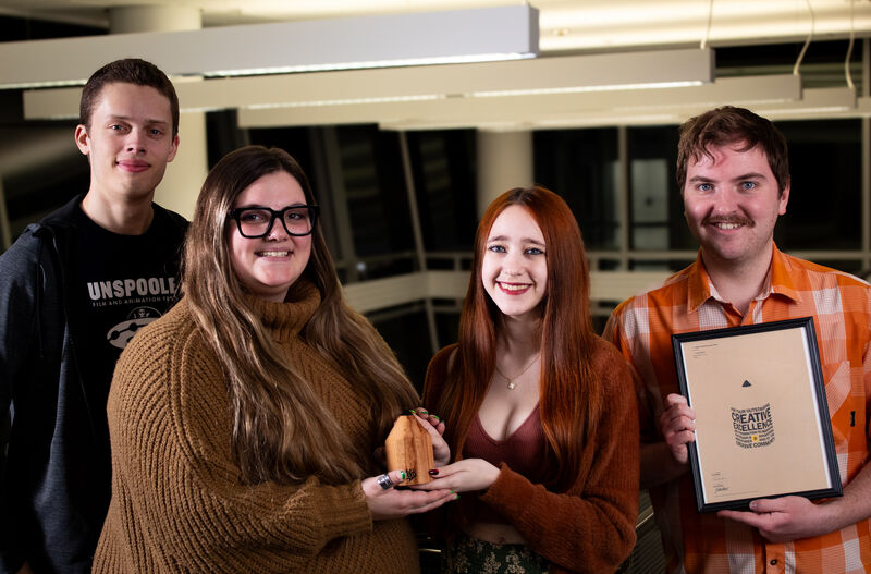 Adobe Express Play team members (left to right) Cole Finn, Ella Johnson, Ava Hedlund and Doran Exline, with their Wood Pencil award. Photo provided by Cole Finn.
