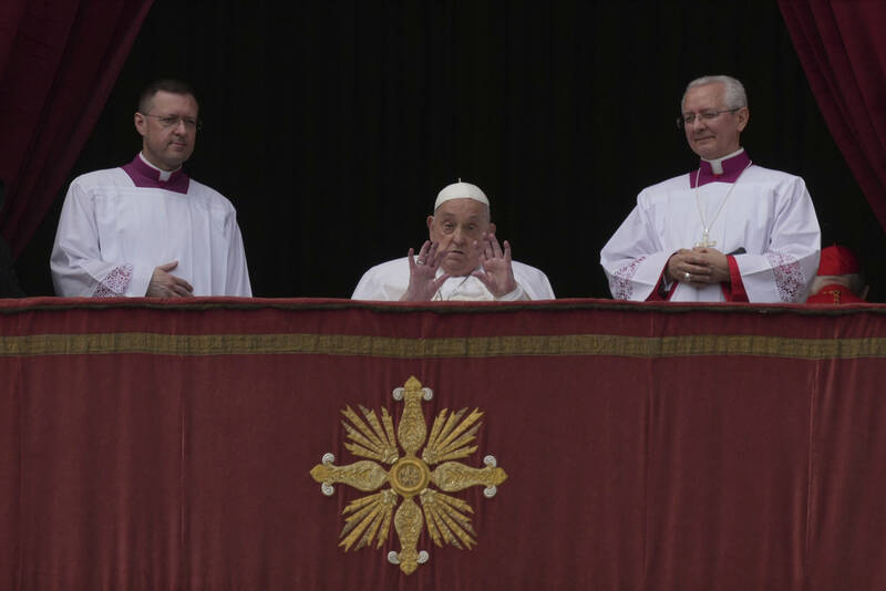 Pope Francis appears on the central lodge of St. Peter's Basilica to bestow the Urbi et Orbi (Latin for to the city and to the world) blessing at the end of the Easter mass presided over by Cardinal Angelo Comastri in St. Peter's Square at the Vatican Sunday, April 20, 2025.(AP Photo/Andrew Medichini)