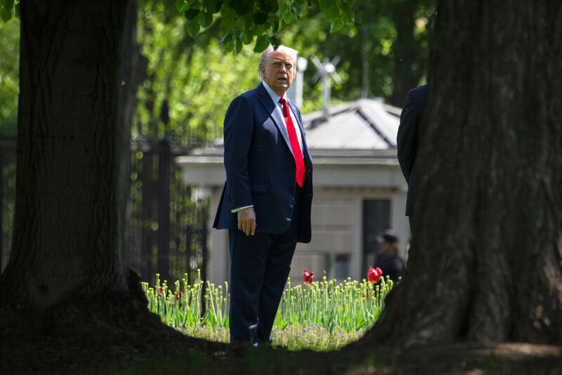 President Donald Trump stands on the North Lawn of the White House in Washington, Wednesday, April 23, 2025. (AP Photo/Mark Schiefelbein)