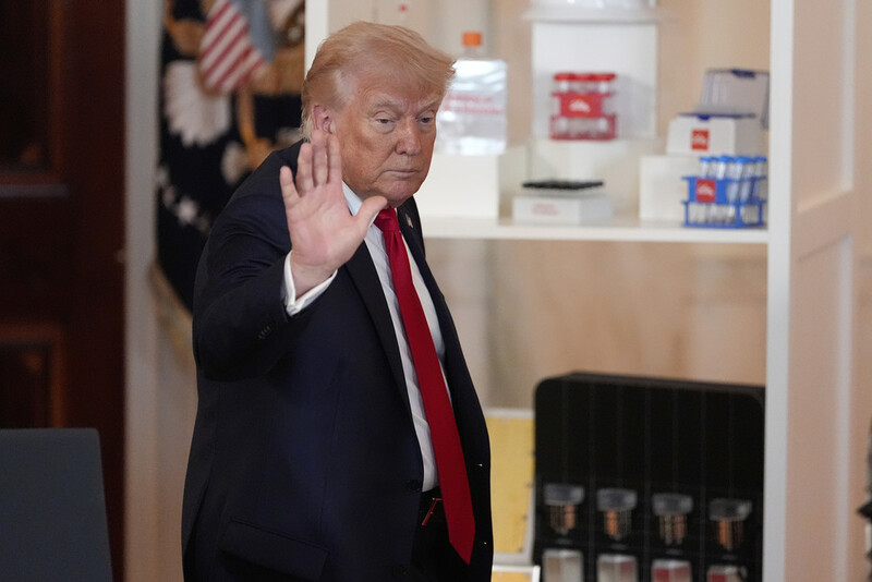 President Donald Trump waves after speaking about investing in America in the Cross Hall of the White House, Wednesday, April 30, 2025, in Washington. (AP Photo/Alex Brandon)