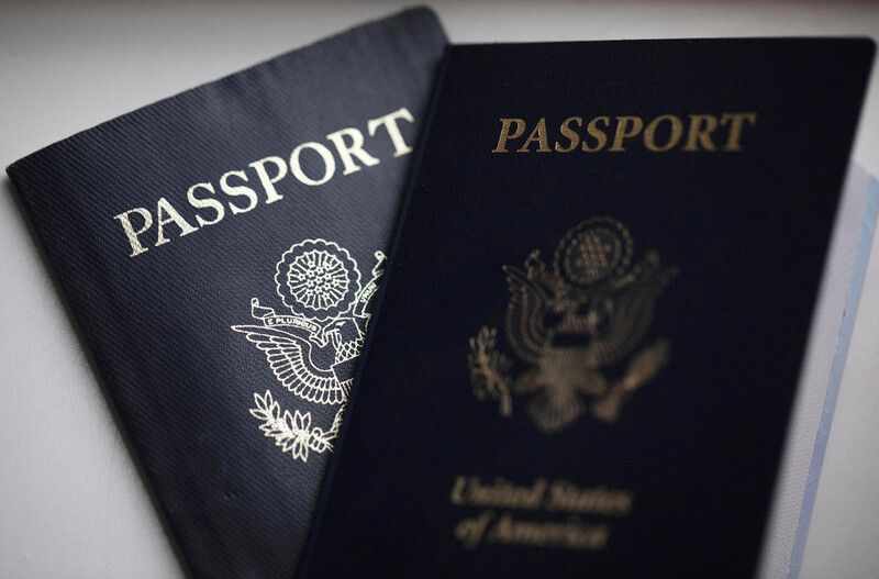 FILE - U.S. passports are arranged for a photograph in Tigard, Ore., on Dec. 11, 2021. (AP Photo/Jenny Kane, File)