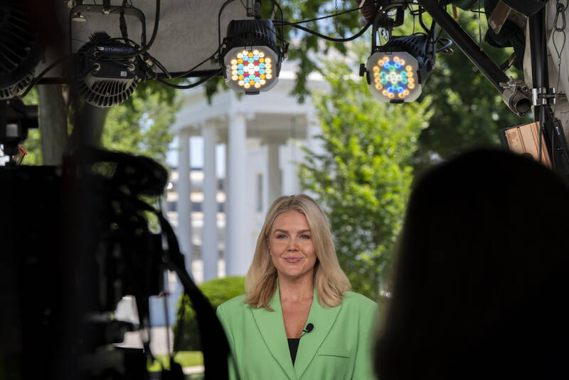 White House press secretary Karoline Leavitt does a television interview at the White House, Monday, June 2, 2025, in Washington. (AP Photo/Alex Brandon)
