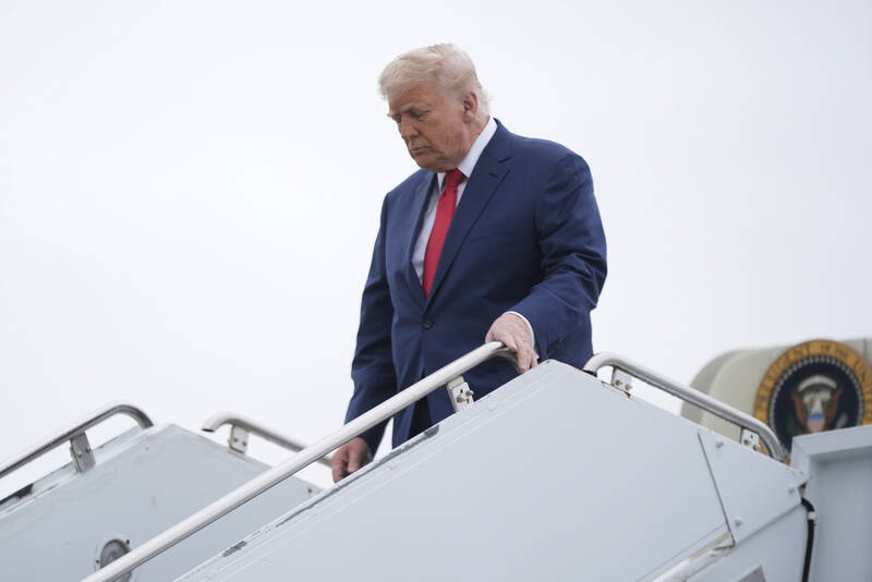 President Donald Trump arrives on Air Force One at Hagerstown Regional Airport, in Hagerstown, Md., on his was to Camp David, Md., Sunday, June 8, 2025. (AP Photo/Manuel Balce Ceneta)