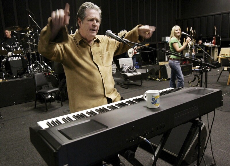 FILE - Brain Wilson, leader of The Beach Boys, performs the song "Heroes and Villains" during a rehearsal at a sound stage in Burbank, Calif., Sept. 22, 2004. (AP Photo/Kevork Djansezian, File)