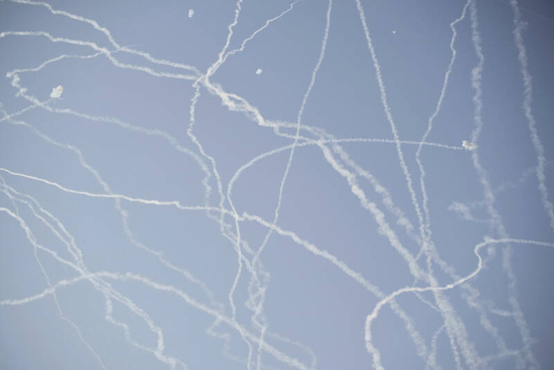 FILE - Israeli air defense system fires to intercept missiles during an Iranian attack over Tel Aviv, Israel, Thursday, June 19, 2025. (AP Photo/Leo Correa, File)