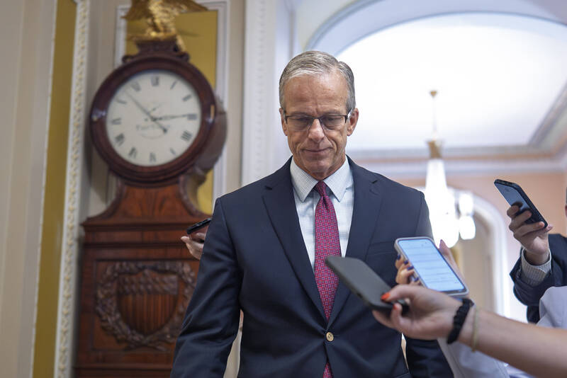 Senate Majority Leader John Thune, R-S.D., walks to the chamber as Senate Republicans work to pass President Donald Trump's bill of tax breaks and spending cuts by his July Fourth deadline, at the Capitol in Washington, Sunday, June 29, 2025. (AP Photo/J. Scott Applewhite)