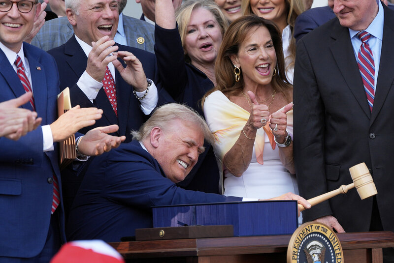 President Donald Trump bangs a gavel after signing his signature bill of tax breaks and spending cuts at the White House in Washington, Friday, July 4, 2025.(AP Photo/Alex Brandon, Pool)