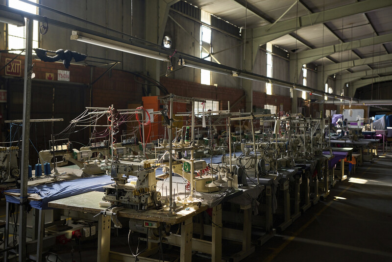 Sewing machines are lined up inside the empty Tzicc clothing factory following the threat of U.S.-imposed tariffs in Maseru, Lesotho, Tuesday, July 22, 2025. (AP Photo/Bram Janssen)