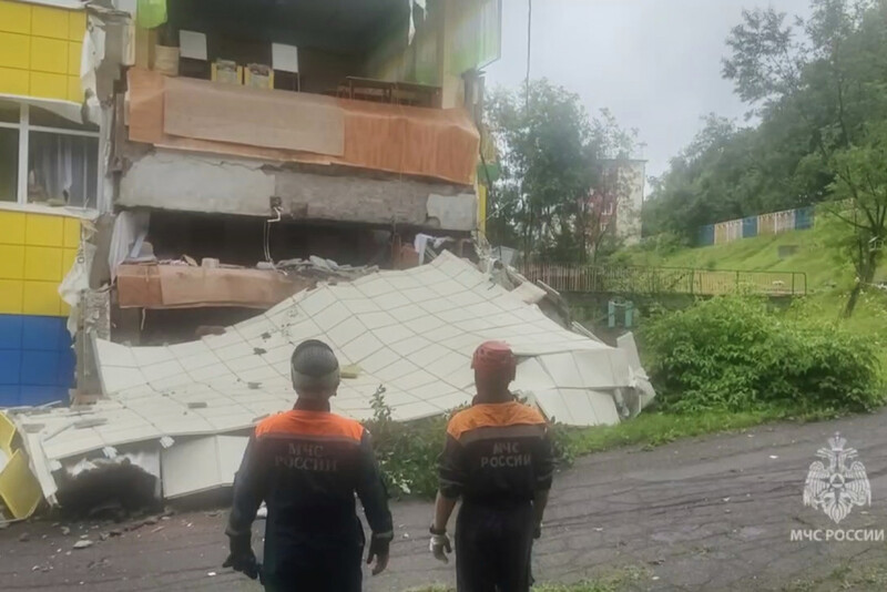 In this image taken from a video released by Russian Emergency Ministry Press Service, rescuers inspect a kindergarten damaged by an earthquake in Petropavlovsk-Kamchatsky, Russia, Wednesday, July 30, 2025. (Russian Emergency Ministry Press Service via AP)
