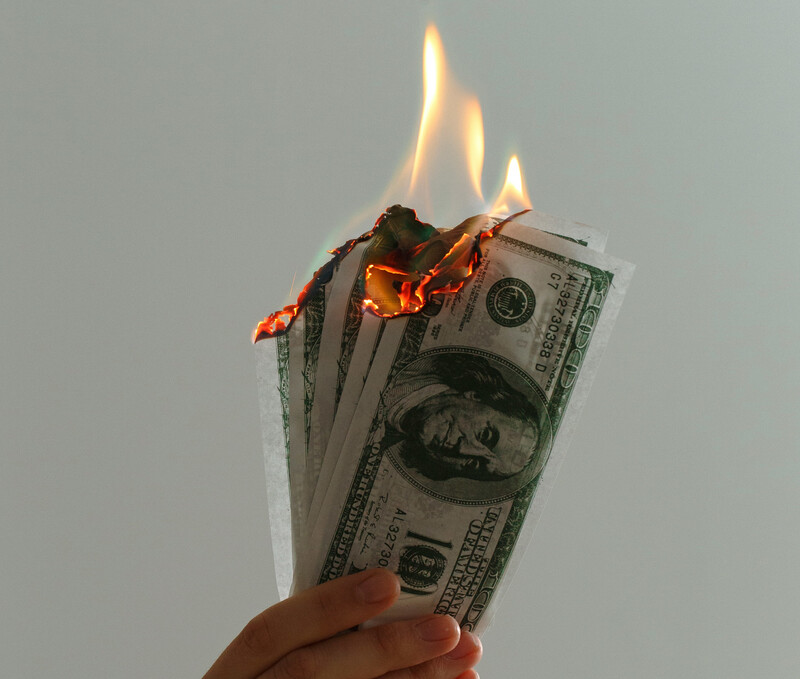 image of burning money