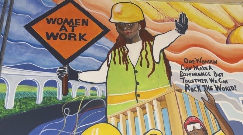 FILE - A mural by artist Tene Smith is seen near the entrance of Chicago Women in Trades, a nonprofit dedicated to training and retaining women in the skilled construction trades is photographed April 1, 2025, at the facility in Chicago. (AP Photo/Claire Savage, File)