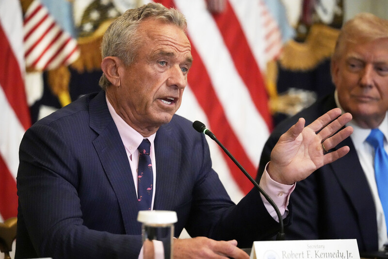 Health and Human Services Secretary Robert F. Kennedy Jr. speaks as President Donald Trump listens at an event to promote his proposal to improve Americans' access to their medical records in the East Room of the White House, Wednesday, July 30, 2025, in Washington. (AP Photo/Mark Schiefelbein)