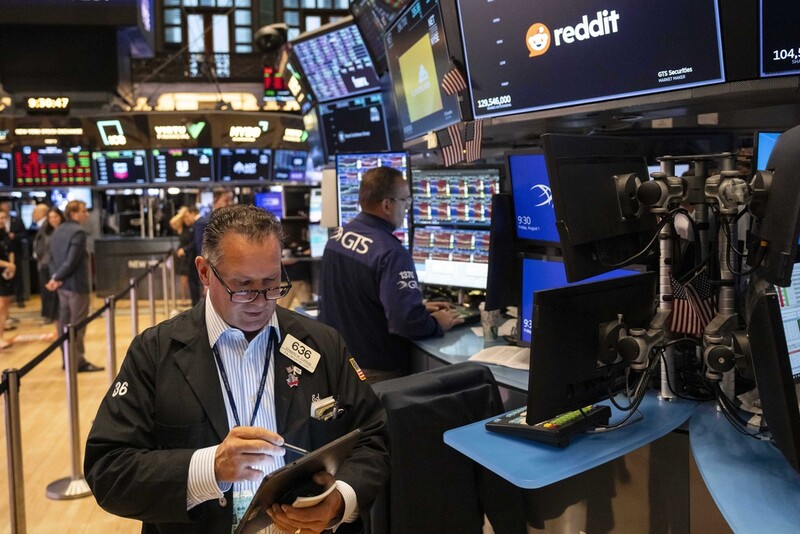 Traders work on the floor of the New York Stock Exchange, Friday, Aug. 1, 2025, in New York. (AP Photo/Yuki Iwamura)