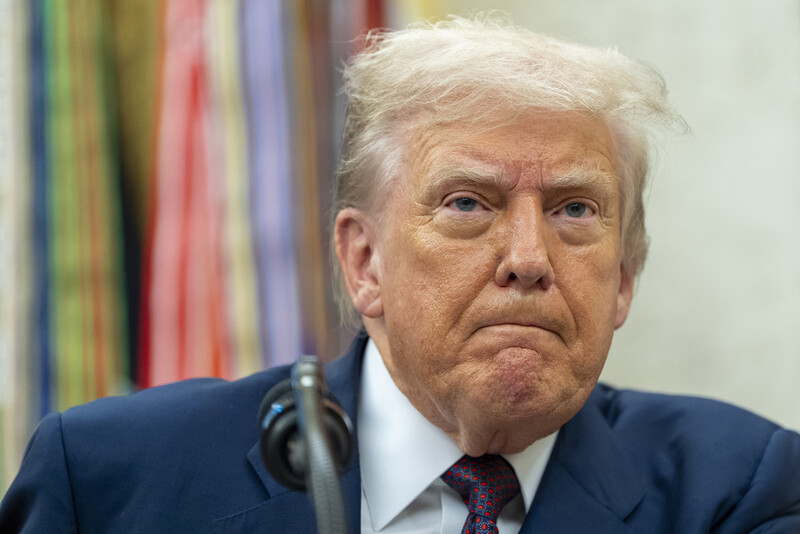 President Donald Trump pauses while speaking during an announcement about Apple with Apple CEO Tim Cook in the Oval Office, Wednesday, Aug. 6, 2025, in Washington. (AP Photo/Alex Brandon)