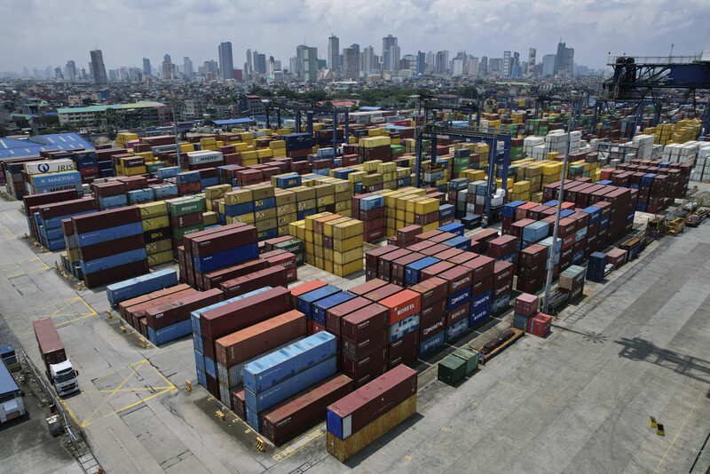 Stacks of containers are seen at the Manila North Harbour Port in Manila, Philippines, Thursday, Aug. 7, 2025. (AP Photo/Aaron Favila)