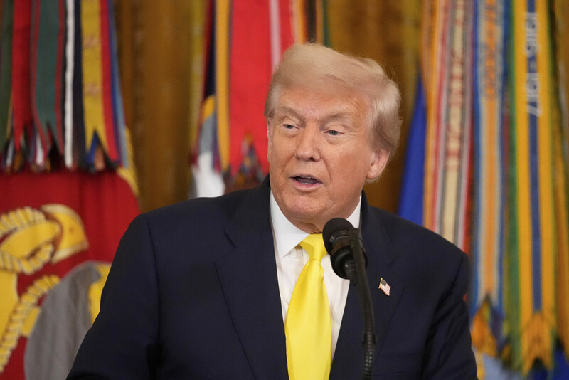 President Donald Trump speaks at an event to mark National Purple Heart Day in the East Room of the White House, Thursday, Aug. 7, 2025, in Washington. (AP Photo/Mark Schiefelbein)