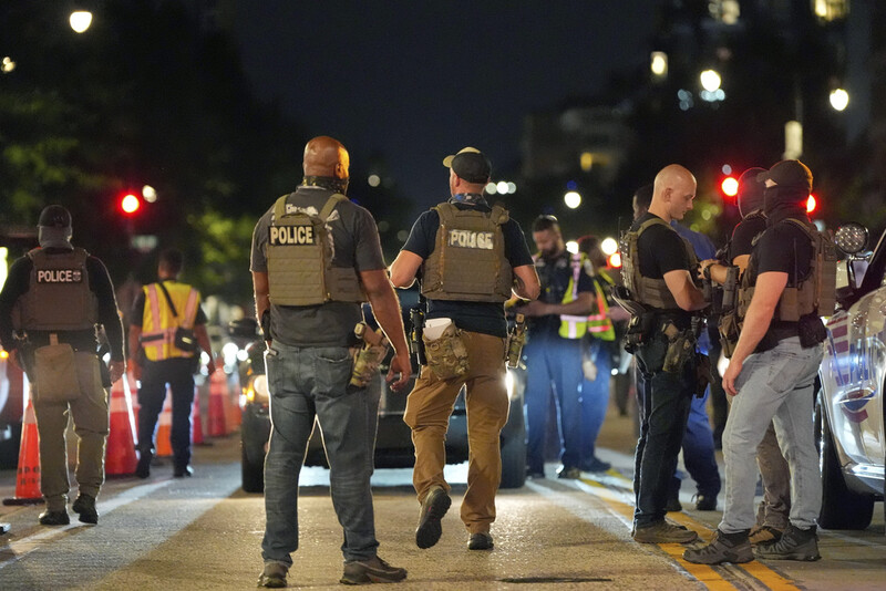 Department of Homeland Security Investigations agents join Washington Metropolitan Police Department officers as they conduct traffic checks at a checkpoint along 14th Street in northwest Washington, Wednesday, Aug. 13, 2025, in Washington. (AP Photo/Alex Brandon)
