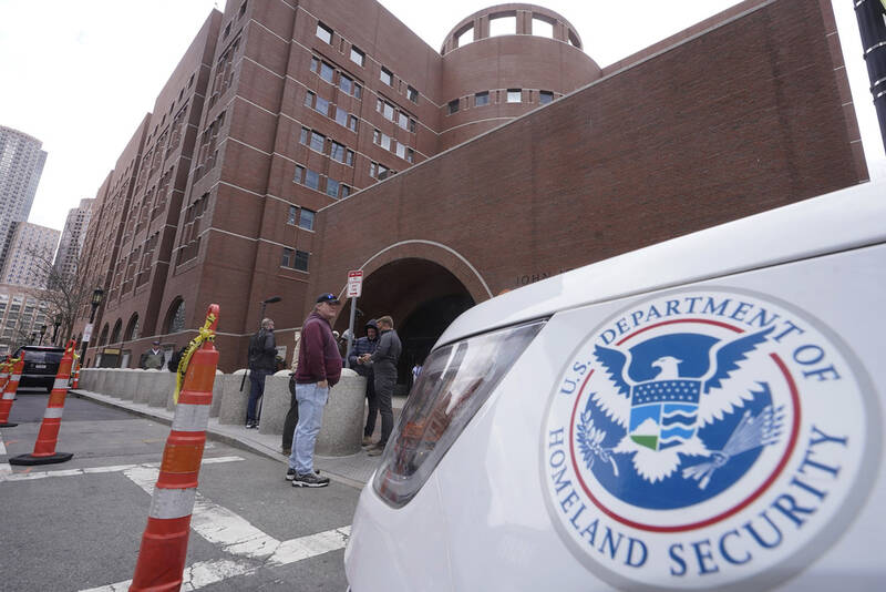FILE - A Homeland Security vehicle, right, is parked outside the Moakley Federal Courthouse, April 19, 2023, in Boston. (AP Photo/Steven Senne, File)