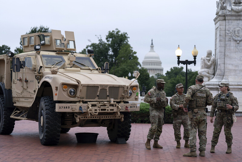 Members of the District of Columbia National Guard patrol outside Union Station, Tuesday, Aug. 19, 2025, in Washington. (AP Photo/Jose Luis Magana)