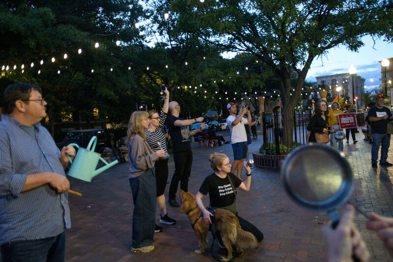 People hold a grassroots, daily, five-minute pots and pans protest to demonstrate against President Donald Trump's immigration policies, in the Mt. Pleasant neighborhood of Washington, Tuesday, Aug. 26, 2025. (AP Photo/Rod Lamkey, Jr.)
