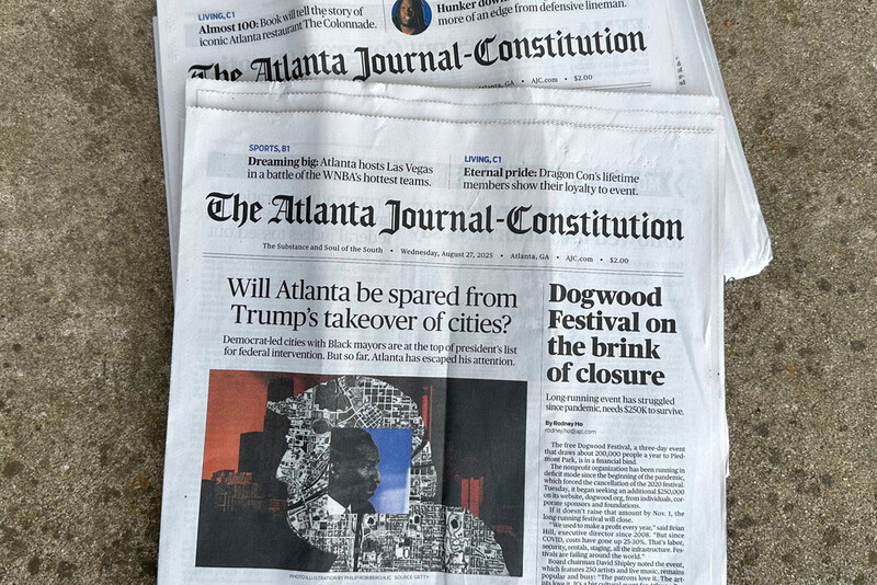 Printed copies of The Atlanta Journal-Constitution are shown on Thursday, Aug. 28, 2025, in Atlanta. (AP Photo/Jeff Amy)