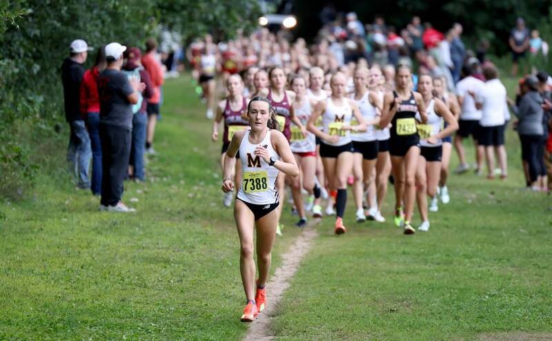 Lauren McCalla (7388) led the Menomonie girls cross country team to a season-opening first place win and finished in the second-best time in school history to take medalist honors. Photo: Joel Anderson