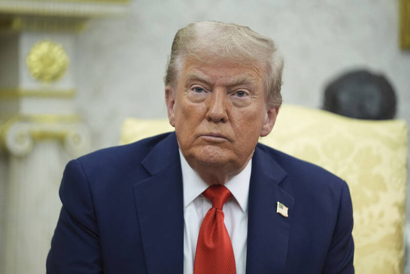 President Donald Trump listens during a meeting with Polish President Karol Nawrocki in the Oval Office of the White House, Wednesday, Sept. 3, 2025, in Washington. (AP Photo/Evan Vucci)