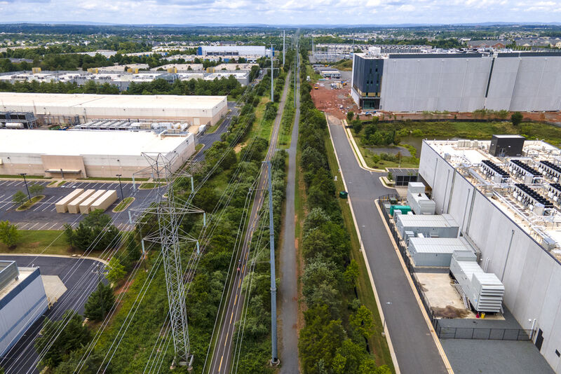 FILE - High-voltage transmission lines provide electricity to data centers in Ashburn in Loudon County, Virginia, on Sunday, July 16, 2023. (AP Photo/Ted Shaffrey, File)