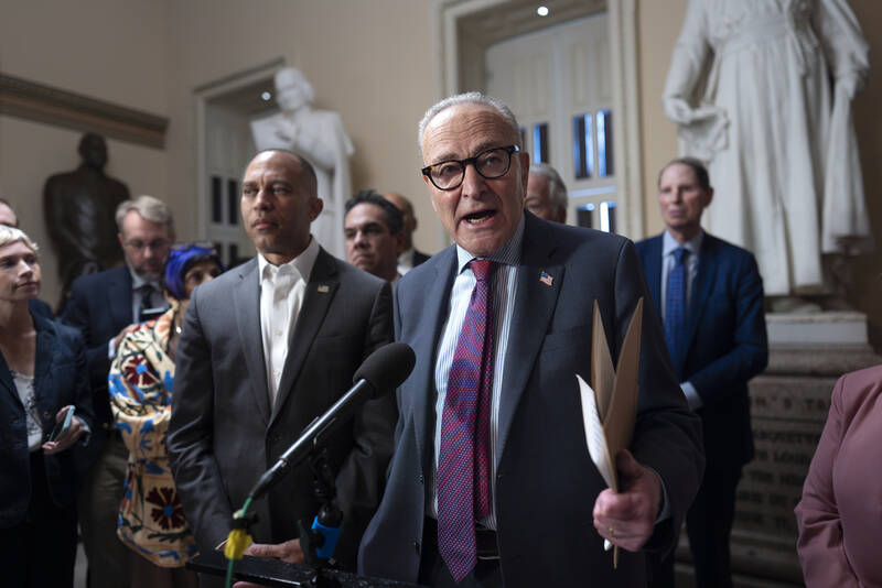 Senate Minority Leader Chuck Schumer, D-N.Y., joined at left by House Minority Leader Hakeem Jeffries, D-N.Y., speaks to reporters after meeting about Republican efforts to cut health care spending, at the Capitol in Washington, Thursday, Sept. 11, 2025. (AP Photo/J. Scott Applewhite)