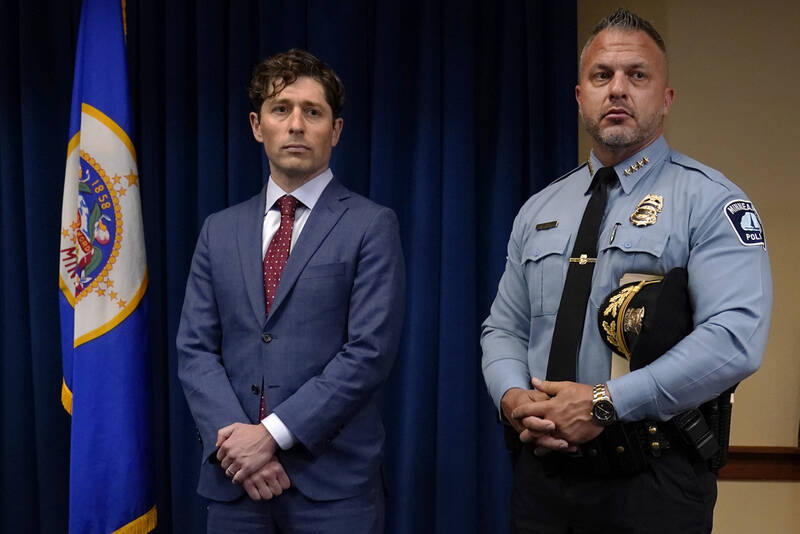 FILE - Minneapolis Mayor Jacob Frey, left, and Police Chief Brian O'Hara stand during a news conference about a Department of Justice report that found the Minneapolis Police Department has engaged in a pattern or practice of discrimination, June 16, 2023, in Minneapolis. (AP Photo/Abbie Parr, file)