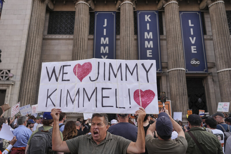Oscar Villanueva holds a sign outside El Capitan Entertainment Centre, where the late-night show "Jimmy Kimmel Live!" is staged, Thursday, Sept. 18, 2025, in Los Angeles. (AP Photo/Jae C. Hong)