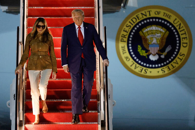 President Donald Trump and first lady Melania Trump disembark Air Force One at Joint Base Andrews, Md., Thursday, Sept. 18, 2025, after returning from a state visit to Britain. (AP Photo/Luis M. Alvarez)