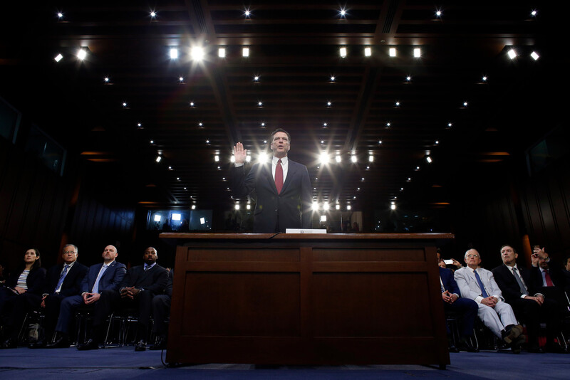 FILE - Former FBI Director James Comey is sworn in during a Senate Intelligence Committee hearing on Capitol Hill, June 8, 2017, in Washington. (AP Photo/Alex Brandon, File)