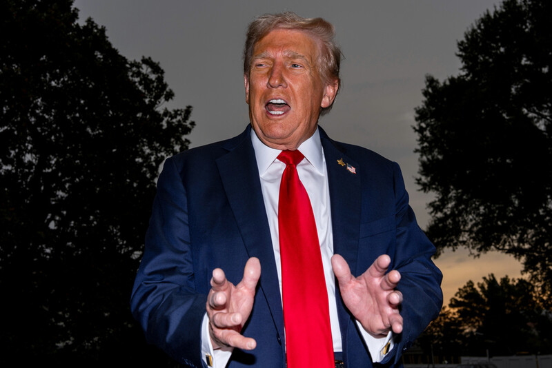 President Donald Trump speaks with reporters before departing on Marine One from the South Lawn of the White House, Tuesday, Sept. 30, 2025, in Washington. (AP Photo/Alex Brandon)