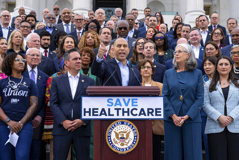House Minority Leader Hakeem Jeffries, D-N.Y., center, flanked by Rep. Pete Aguilar, D-Calif., left, and Rep. Katherine Clark, D-Mass., arrives to speak on the steps of the Capitol to insist that Republicans include an extension of expiring health care benefits as part of a government funding compromise, in Washington, Tuesday, Sept. 30, 2025. (AP Photo/J. Scott Applewhite)