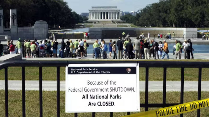 A sign indicates the closing of federal services during the government shutdown in 2013. AP Photo/Susan Walsh