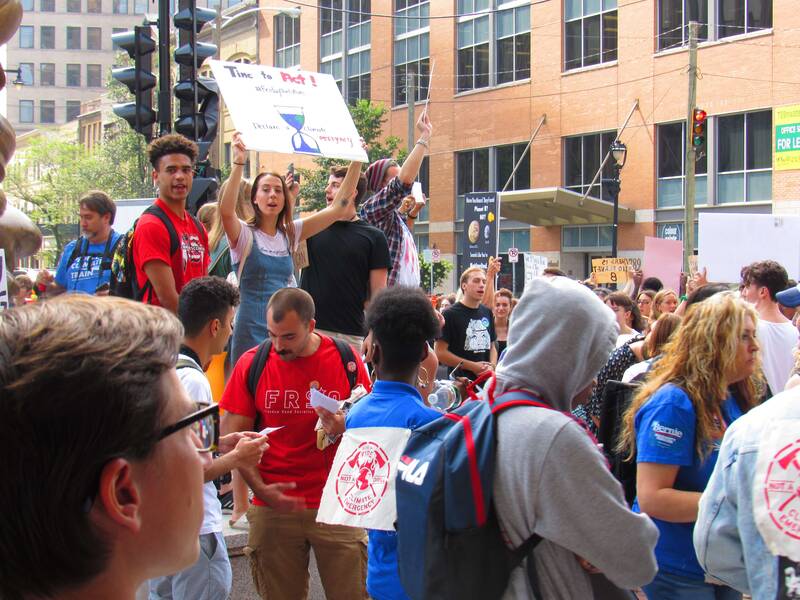 Protesters in Milwaukee take part in a 2019 march demanding action to address climate change. Fifteen young people are suing the state of Wisconsin for harming their future by allowing pollution that hastens climate change. (Photo by Isiah Holmes/Wisconsin Examiner)