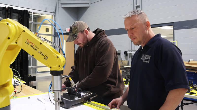 Jason Solberg, right, is a UW-Stout automation leadership student and WCTC instructor. Photo by Waukesha County Technical College.