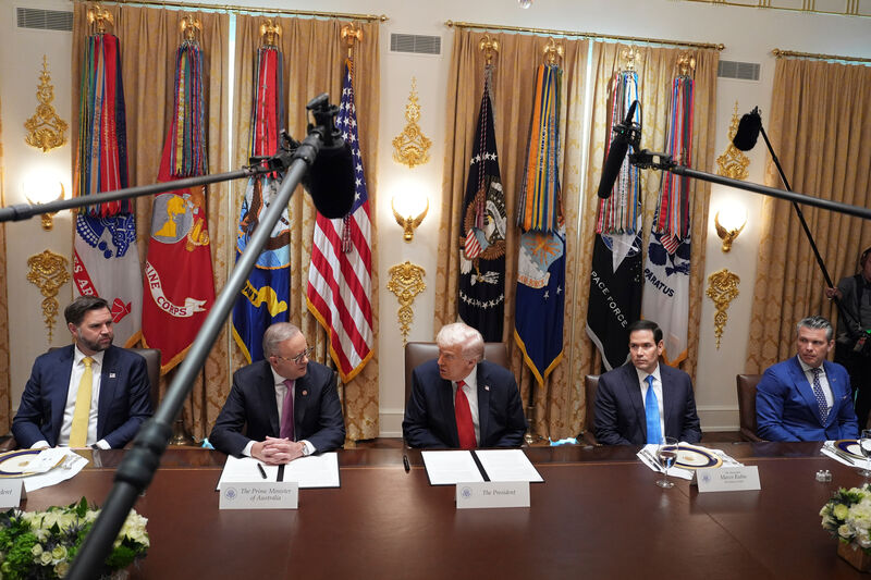 Caption: President Donald Trump, center, meets with Australian Prime Minister Anthony Albanese, second left, as Vice President JD Vance, from left, Secretary of State Marco Rubio and Defense Secretary Pete Hegseth, right, listen, in the Cabinet Room of the White House, Friday, Oct. 20, 2025, in Washington. (AP Photo/Evan Vucci)