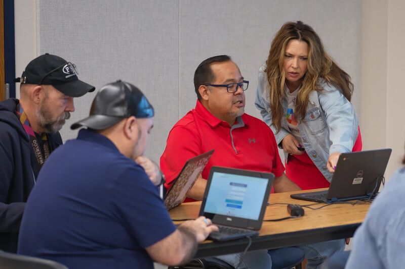 Dr. Geri Gillespy, Microsoft industry advisor, right, speaks with attendees during a Microsoft AI skilling event, Saturday, Sept. 27, 2025, in San Antonio. (AP Photo/Darren Abate)