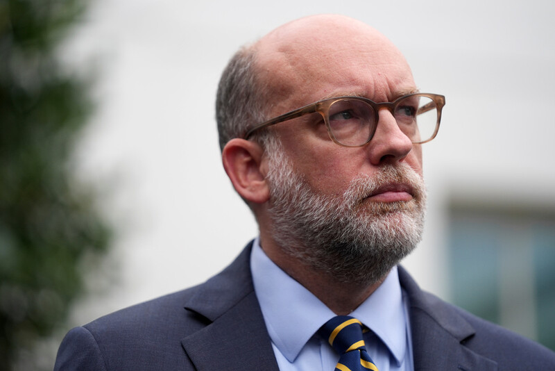 Russell Vought, Office of Management and Budget director, listens as he addresses members of the media outside the West Wing at the White House in Washington, Monday, Sept. 29, 2025, in Washington. (AP Photo/Evan Vucci)