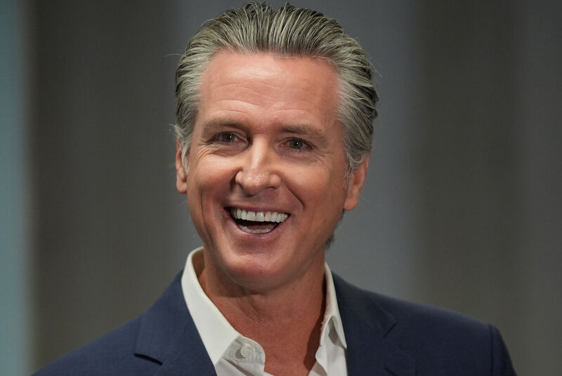 California Gov. Gavin Newsom smiles after signing legislation related to student literacy in Los Angeles on Thursday, Oct. 9, 2025. (AP Photo/Damian Dovarganes)