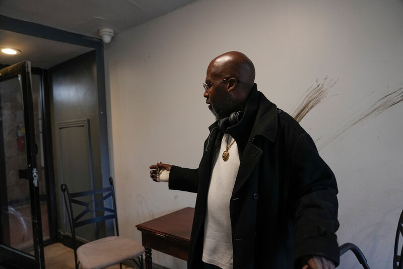 Resident Alex Mannings, who said he was awakened by federal agents during a Sept. 30 raid of the building at 7500 South Shore Drive in Chicago, speaks on Oct. 10, 2025. He described how, "they put me in zip ties, ran my social security number federally, saw that I didn't have any warrants, and let me go." (AP Photo/Erin Hooley)