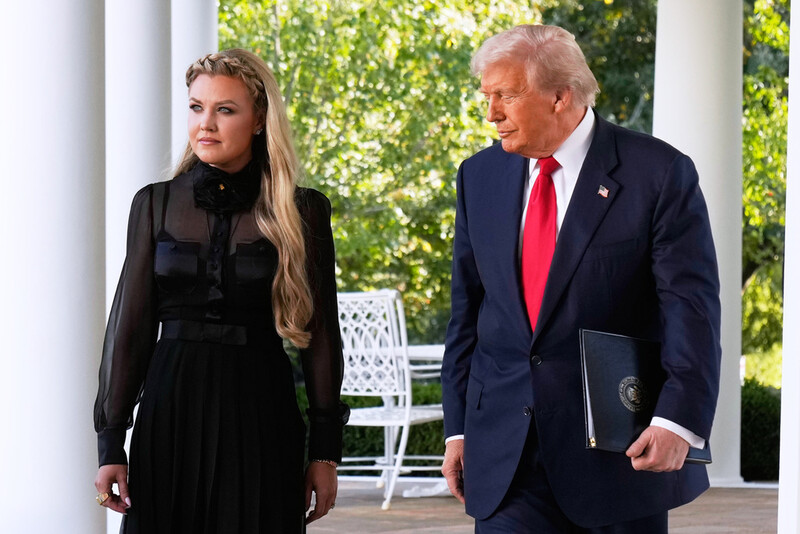 President Donald Trump, with Erika Kirk, walks out to present the Presidential Medal of Freedom for Charlie Kirk to his widow Erika Kirk, in the Rose Garden of the White House, Tuesday, Oct. 14, 2025, in Washington. (AP Photo/Mark Schiefelbein)