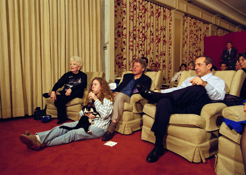 FILE - President Bill Clinton, flanked by Governors Ann Richards of Texas, left, and Mario Cuomo of New York, watches the Dallas Cowboys and Buffalo Bills play in the Super Bowl with his daughter Chelsea and their cat, Socks, in the White House, Jan. 31, 1993, in the family theater. (AP Photo/Wilfredo Lee, File)
